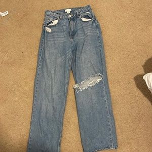 H&M straight high waisted jeans with 1 holler in the right leg US 8